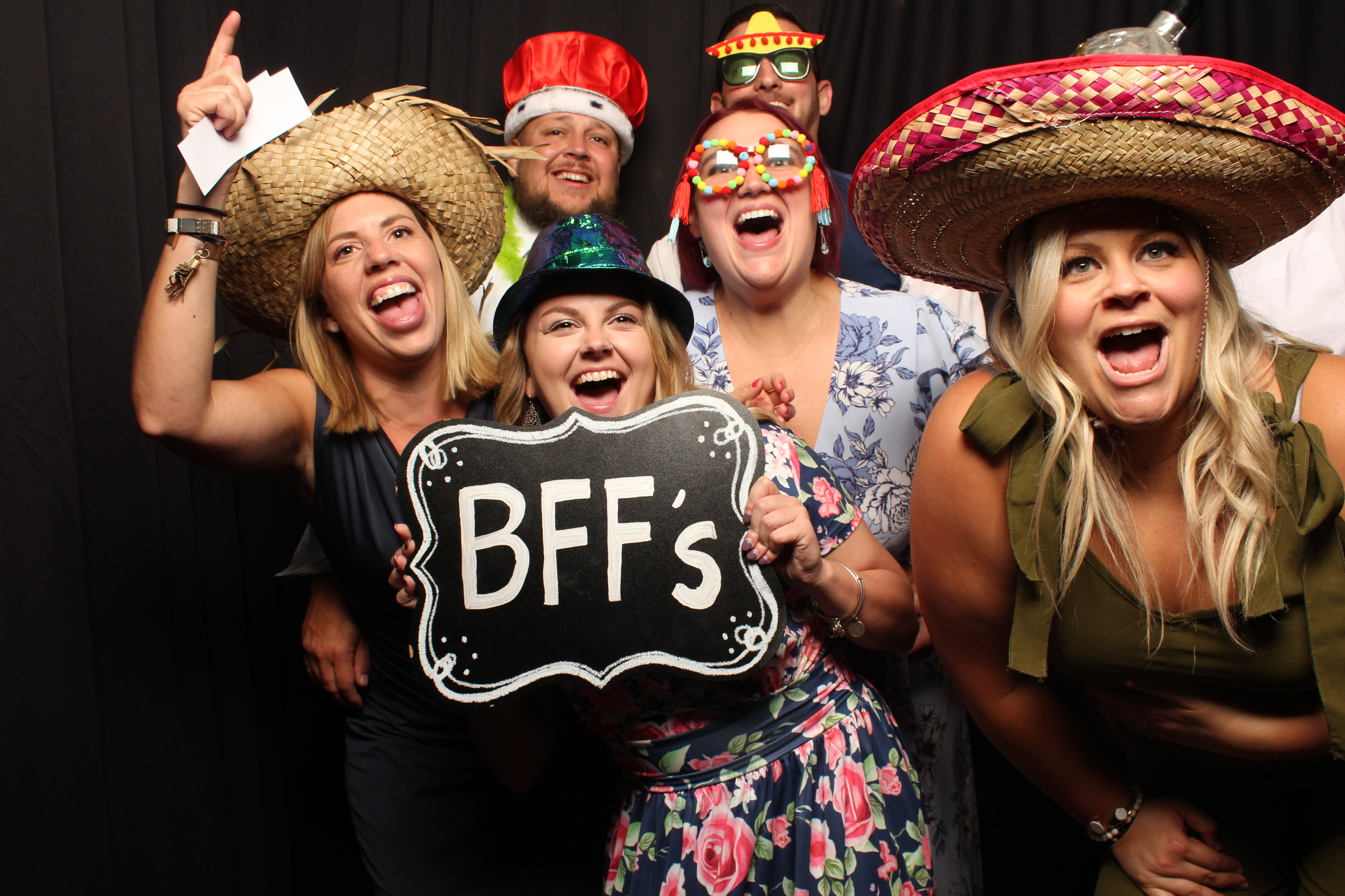 Guests posing in a DNCE Group photobooth